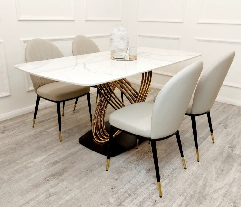 The Orion Dining Table with chairs with white sintered stone top and gold base, upscale home furnishings elegant dining sets, premium tables, marble tables,