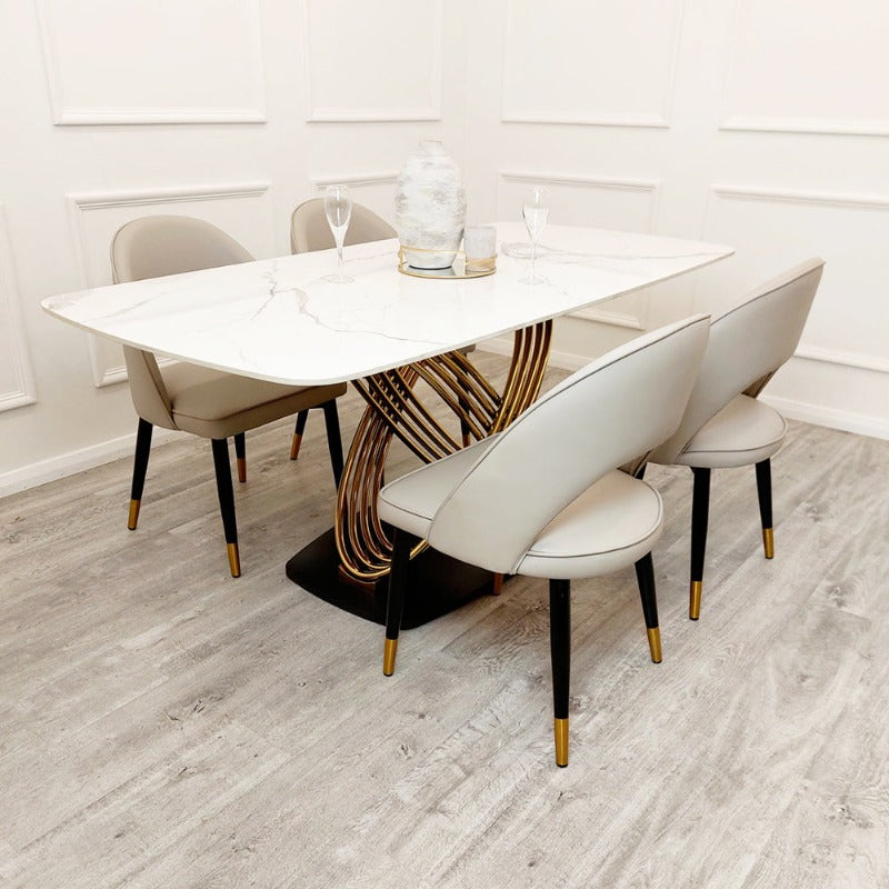 Orion Dining Table features a polar white sintered stone top, gold base, contemporary dining table sets, marble tables, high-end chairs, luxury furniture