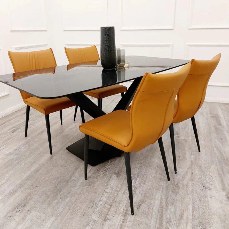 Stylish Apollo Black Dining Table with Black Sintered Stone Striking Design, dining table sculpture. unique table design, modern dining table, glamorous table  with orange chairs