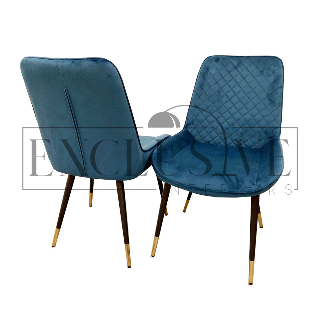 Beautiful Luna Velvet Dining Chair Scandinavian style cross stitch back detail gold tipped black legs. Comfortable luxury chairs, opulent dining chairs styles in blue