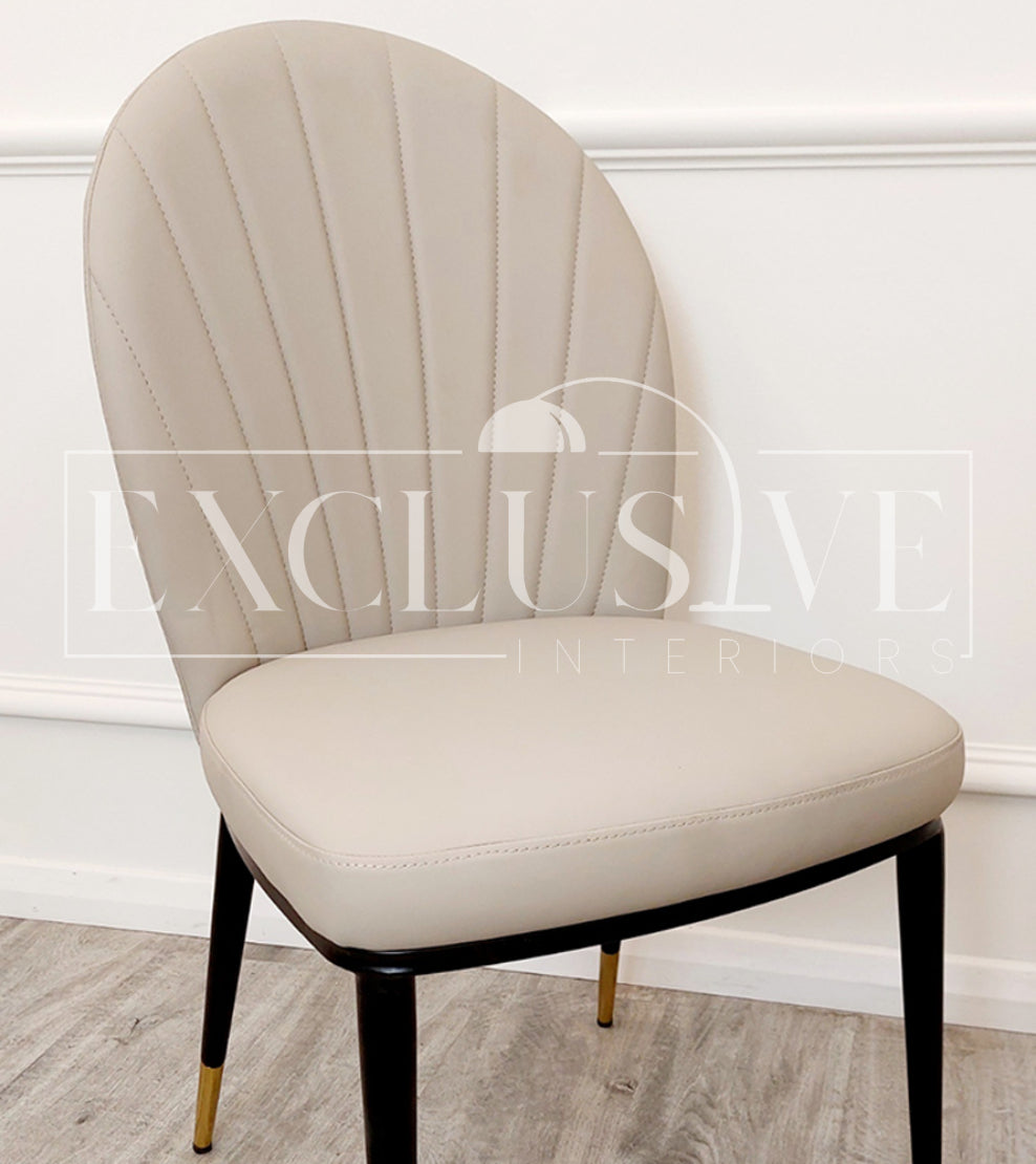 Luxury dining chairs with black legs & beige seat. Leather Curved Back Chairs, premium chairs, chrome dining chairs, fancy dining chairs, sophisticated chairs