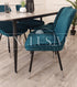 Beautiful Luna Velvet Dining Chair Scandinavian style cross stitch back detail gold tipped black legs. Comfortable luxury chairs, opulent dining chairs styles in teal