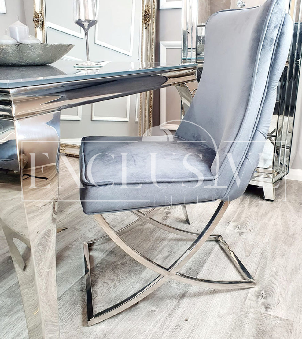 The Sandhurst Crossed Leg Dining Chair, Premium design, chic, comfortable luxury couches, opulent sofa styles, luxurious sofa fabrics, modern luxury design buttoned back, thick cushion, chrome legs in grey fabric