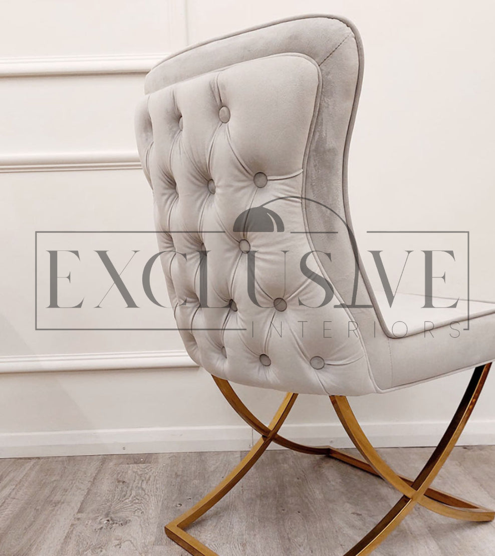 The Sandhurst Crossed Leg Dining Chair, Premium design, chic, comfortable luxury couches, opulent sofa styles, luxurious sofa fabrics, modern luxury design buttoned back, thick cushion, gold legs in grey fabric