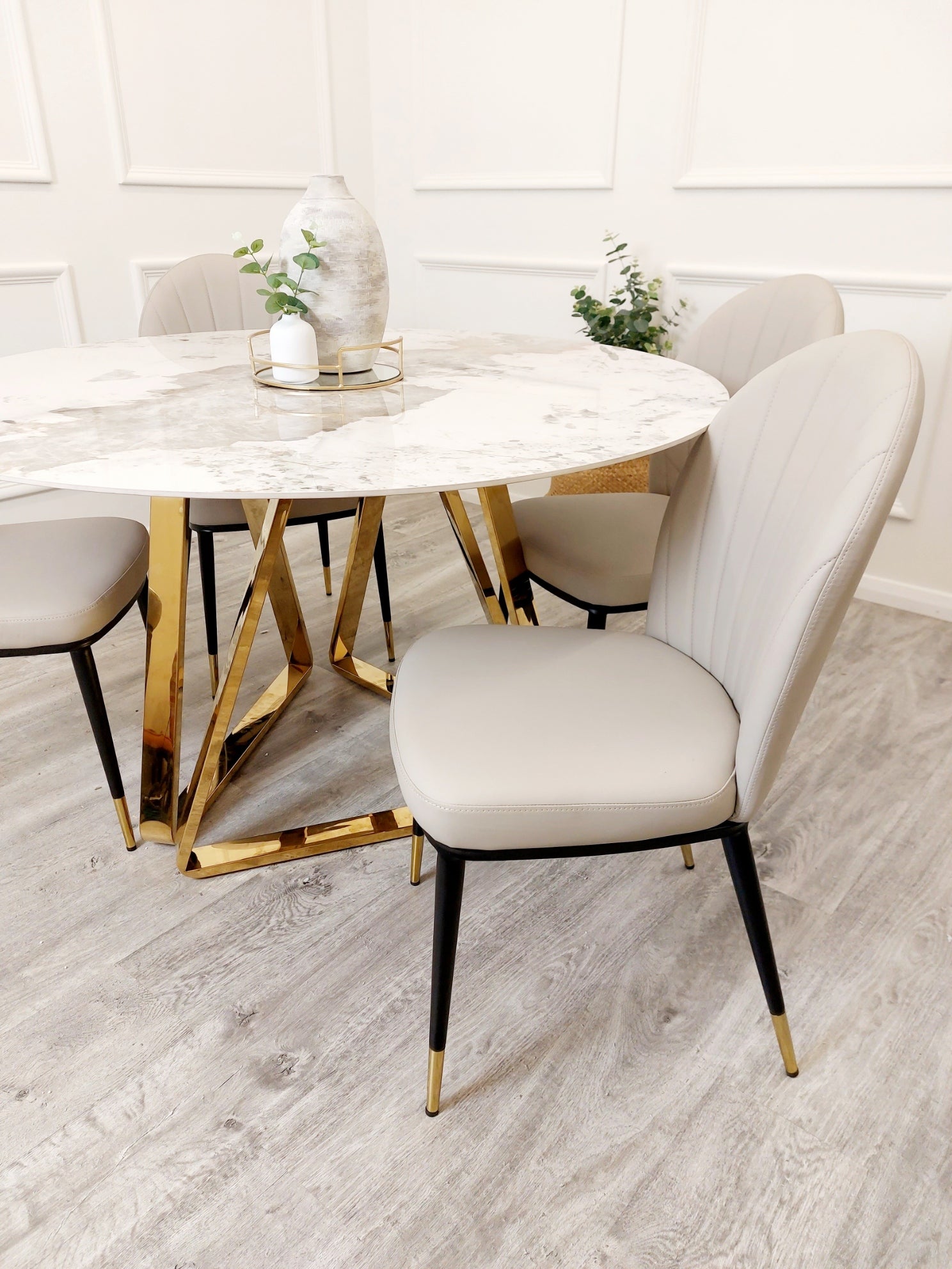 Luxury dining chairs with black legs & beige seat. Leather Curved Back Chairs, premium chairs, chrome dining chairs, fancy dining chairs, sophisticated chairs